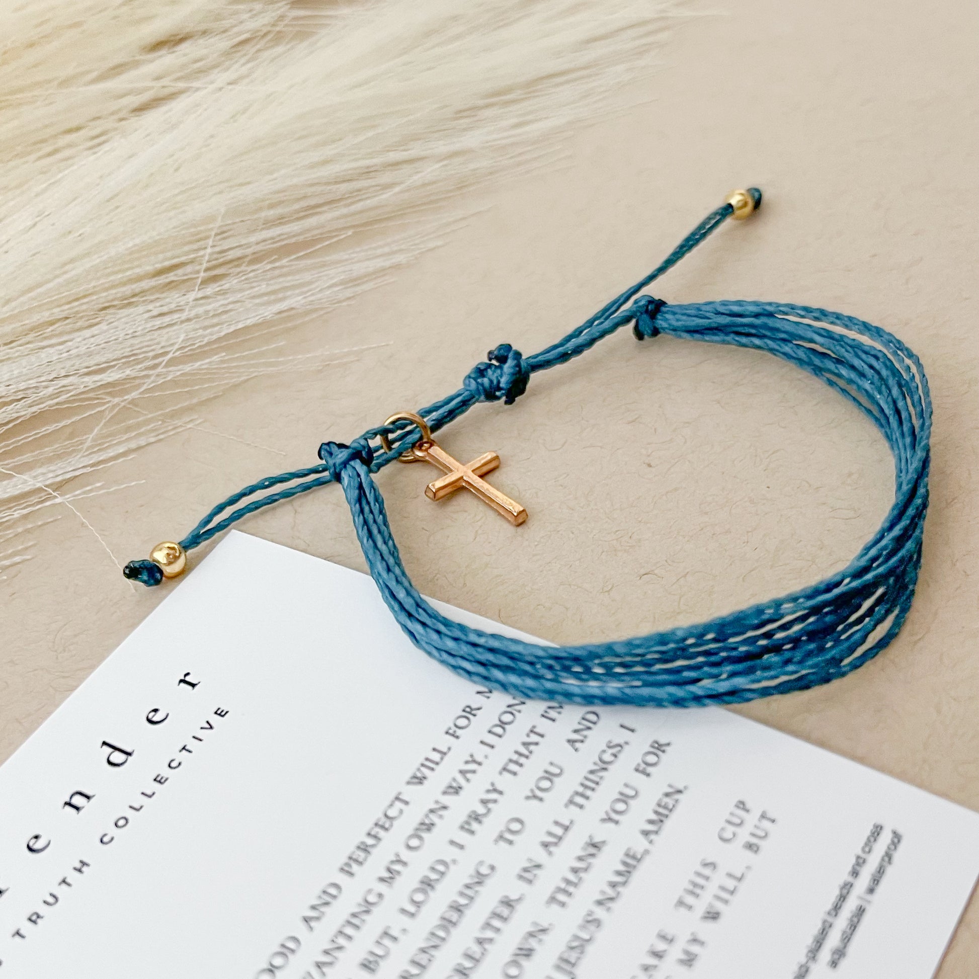 Surrender Bracelet with cross charm on card