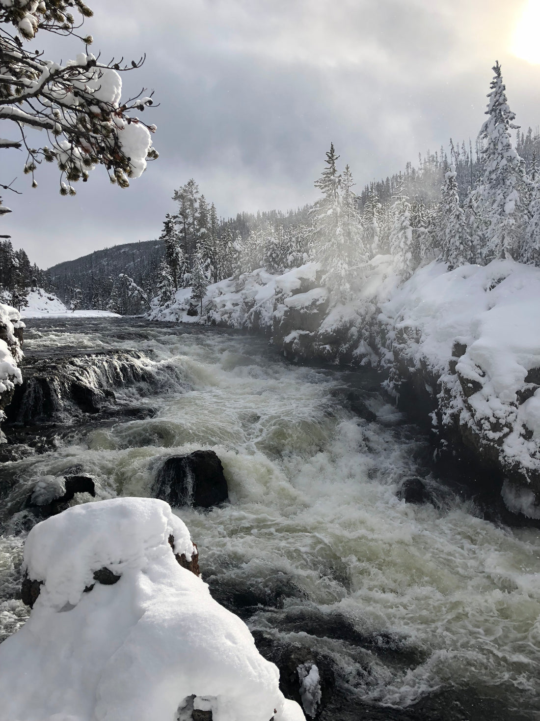 Waterfall with snow in Yellowstone .  God's creation